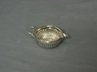 An Edwardian silver cream jug with demi-reeded decoration Sheffield 1905