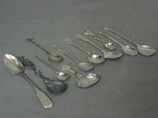 A pewter spoon, a silver caddy spoon and 9 silver spoons