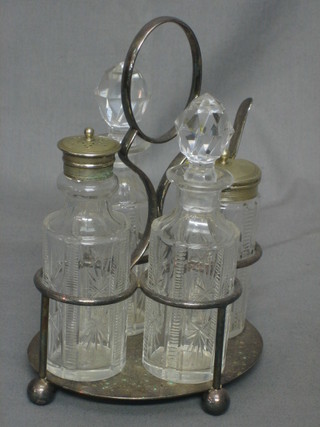 A silver plated 4 bottle cruet