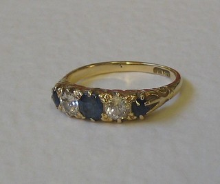 A Victorian 18ct gold dress ring set 2 diamonds supported by sapphires