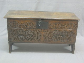 A 17th/18th Century oak coffer of panelled construction with hinged lid 44"