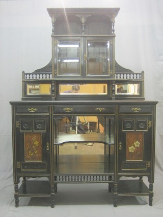 An Edwardian ebonised chiffonier with raised back fitted cupboards enclosed by panelled doors, the base fitted 1 long and 2 short drawers above a niche flanked by a pair of cupboards 51"
