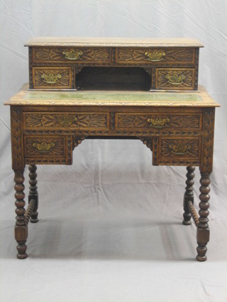 A Victorian carved honey oak writing table, the raised top fitted 2 long drawers above a recess flanked by 2 short drawers, the base fitted 2 long and 2 short drawers, raised on bobbin turned supports 34"