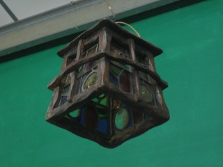 An oak and leaded light hanging hall lantern