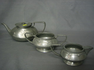 An Art Nouveau Civic pewter 3 piece tea service with teapot, twin handled sugar bowl and cream jug