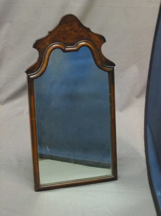 A Queen Anne style arched plate dressing table easel mirror contained in a walnut frame 24"