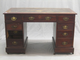 An Edwardian mahogany kneehole pedestal desk with inset leather writing surface, fitted 9 drawers 47"
