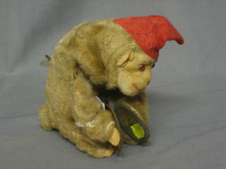 A clockwork figure of a monkey playing cymbals
