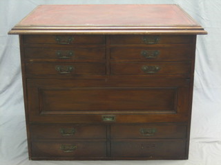 A rectangular mahogany plan chest with inset tooled writing surface above 10 short drawers and with plan chest slide 40"