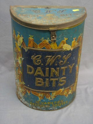 A crescent shaped C W S Daintybits sweet tin