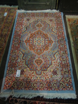 A fine quality contemporary blue ground and floral patterned Persian rug with multi-row borders 65" x 36"