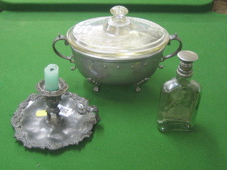 A Britannia metal chamber stick 6", an oval planished pewter casserole dish 11" and a pewter bottle