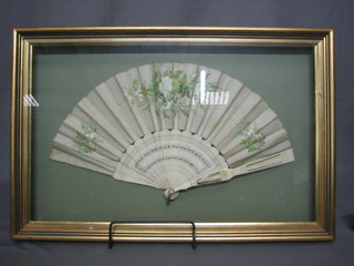 A 19th Century pierced ivory fan with painted floral decoration 16"