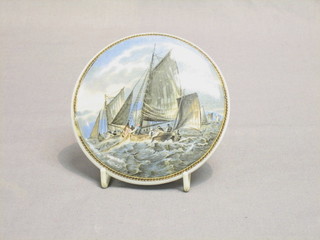 A circular 19th Century Prattware pot lid decorated a fishing boat, (chips to base) 4"