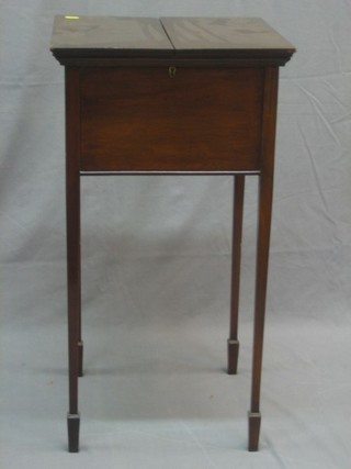 An Edwardian square mahogany sewing box with hinged lid, raised on square tapering supports 15 1/2"