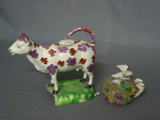 An 18th Century Staffordshire lustre cow creamer 7" (f) and a Staffordshire figure of a seated bird 4" (f)