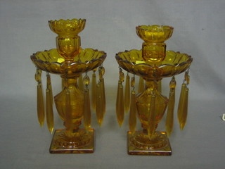 A pair of amber glass lustres with detachable sconces 10"