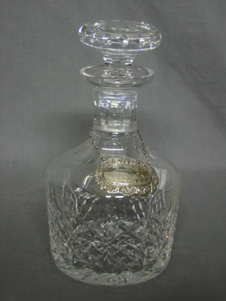 A cut glass mallet shaped decanter 9" with silver decanter label