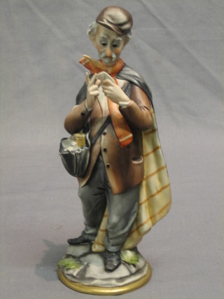 A Capo di Monte figure of a standing Continental postman 9"