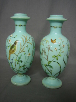 A pair of Victorian turquoise glass vases decorated birds amidst branches 13"
