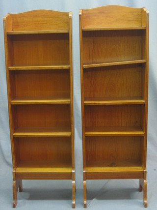 A pair of Regency style satinwood open bookcases fitted 5 shelves, raised on splayed feet 15"