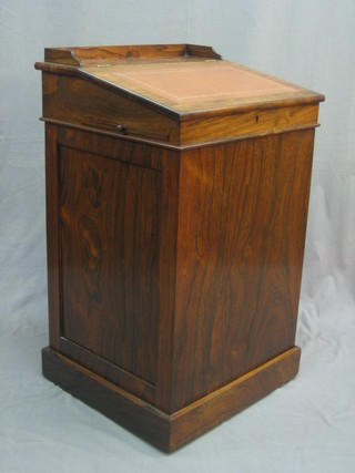 A Regency rosewood Davenport with sliding top, the pedestal fitted 4 long drawers, raised on a platform base 21"