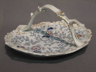 A 19th Century porcelain twin handled oval shaped dish with floral decoration, the base marked Lady Peel F & M Co, 11 1/2"