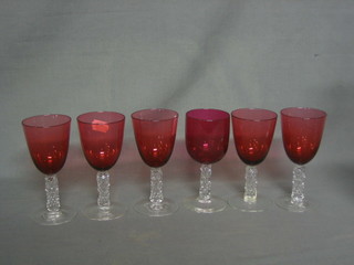 6 cranberry glass wine glasses with faceted glass stems and 9 other glasses