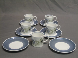 An 11 piece Susie Cooper Glenmist pattern coffee service comprising 5 cups and 6 saucers