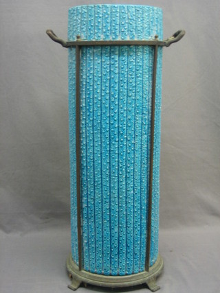 A turquoise pottery stick stand of bamboo form raised on a brass base