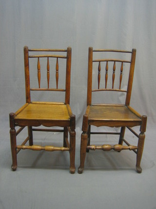 A set of 6 18th/19th Century Country elm stick and bar back dining chairs with solid seats, raised on turned supports