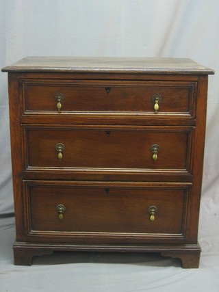 An 18th/19th Century Continental oak chest of 3 long drawers, raised on bracket feet 31"