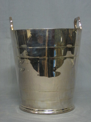 A silver plated twin handled wine cooler marked CH