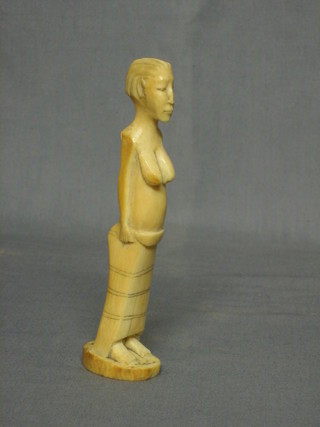 An Eastern carved ivory figure of a standing lady 6"