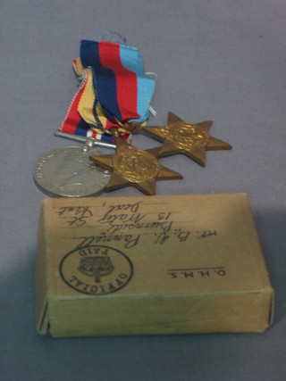 A group of 3 medals 1939-45 Star, African Star and British War medal together with original cardboard carton