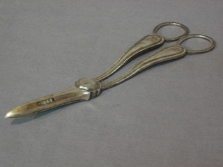 A pair of silver plated grape scissors by Walker & Hall