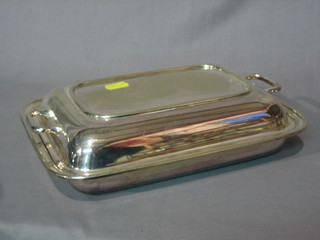 An oval twin handled silver plated entree dish and cover