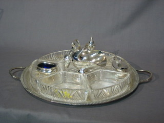A circular silver plated tray with 7 section  glass hors d'eouvres dish, a silver plated sugar scuttle and a 3 piece silver plated cruet