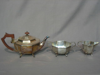 An Art Deco octagonal silver plated 3 piece tea service comprising teapot, twin handled sugar bowl and cream jug
