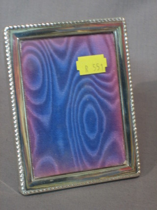 A modern silver easel photograph frame 4" x 3"