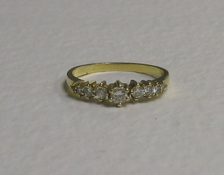 A lady's 18ct gold half hoop dress ring set 9 diamonds