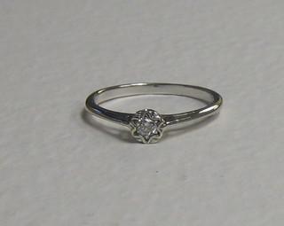 A lady's 18ct white gold dress/engagement ring set a solitaire diamond