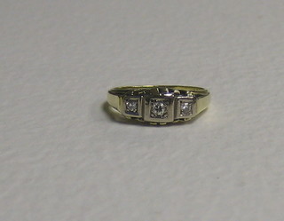 A gold dress ring set 3 diamonds