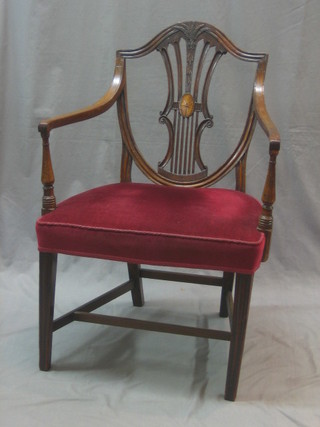 A Hepplewhite style open arm chair with shield back and upholstered seat, raised on square supports with H framed stretcher