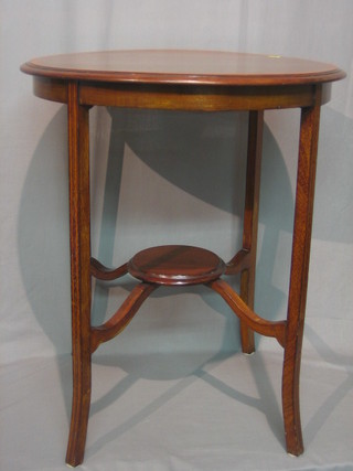 An Edwardian circular inlaid mahogany 2 tier occasional table raised on outswept supports 23"