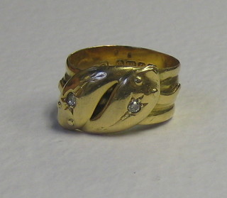 An 18ct gold double serpent ring, the eyes set diamonds