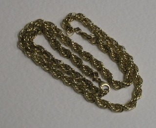 A gold multi-link necklace and a do. bracelet
