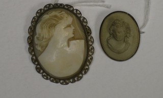 A shell carved cameo portrait brooch and 1 other cameo brooch