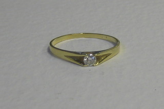 A lady's 18ct gold dress ring set a small diamond