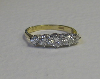 A lady's 18ct gold engagement ring set 5 diamonds (approx 1.25ct)